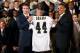 WASHINGTON - AUGUST 09: New Orleans Saints quarterback and National Football League MVP Drew Brees (L) presents U.S. President Barack Obama (R) with a Saints jersey during a reception for the 2010 National Football League Super Bowl champions at the Whit