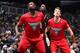 Nazr Mohammed (left) and Mike Dunleavy (right) box out Brooklyn Nets forward Kevin Garnett (middle).