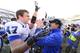 Nov 30, 2013; Chapel Hill, NC, USA; Duke Blue Devils head coach David Cutcliff with linebacker David Helton (47) after the game. The Duke Blue Devils defeated the North Carolina Tar Heels 27-25 at Kenan Memorial Stadium. Mandatory Credit: Bob Donnan-USA