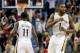 Dec 30, 2013; New Orleans, LA, USA; New Orleans Pelicans point guard Tyreke Evans (1) celebrates with teammate point guard Jrue Holiday (11) after hitting a shot to take the lead with 1.2 seconds remaining in the fourth quarter of a game against the Portl