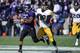 EVANSTON, IL - OCTOBER 27: Venric Mark #5 of the Northwestern Wildcats runs as Micah Hyde #18 of the Iowa Hawkeyes chases him on October 27, 2012 at Ryan Field in Evanston, Illinois. (Photo by David Banks/Getty Images)