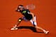 PARIS, FRANCE - JUNE 06: Ernests Gulbis of Latvia returns a shot during his men's singles semi-final match against Novak Djokovic of Serbia on day thirteen of the French Open at Roland Garros on June 6, 2014 in Paris, France. (Photo by Clive Brunskill/G