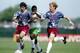 25 MAY 1994: HAMZAH SAEED FALATAH OF SAUDI ARABIA IS SANDWICHED BETWEEN MARCELO BALBOA #17 AND ALEXI LALAS OF THE USA DURING THE 0-0 TIE AT RUTGERS UNIVERSITY, NEW JERSEY. Mandatory Credit: Simon Bruty/ALLSPORT
