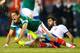 FOXBORO, MA - JUNE 06: Javier Hernandez #14 of Mexico is fouled by Neto #14 of Portugal in the second half during the international friendly match at Gillette Stadium on June 6, 2014 in Foxboro, Massachusetts. (Photo by Jared Wickerham/Getty Images)