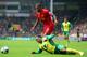 NORWICH, ENGLAND - APRIL 20: Nathan Redmond of Norwich City clashes with Glen Johnson of Liverpool during the Barclays Premier League match between Norwich City and Liverpool at Carrow Road on April 20, 2014 in Norwich, England. (Photo by Jamie McDonald