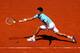 PARIS, FRANCE - JUNE 06: Novak Djokovic of Serbia returns a shot during his men's singles semi-final match against Ernests Gulbis of Latvia on day thirteen of the French Open at Roland Garros on June 6, 2014 in Paris, France. (Photo by Clive Brunskill/G