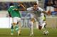 HARRISON, NJ - JUNE 6: Edward Zenteno #21 of Bolivia (L) battles Kostas Mitroglou #9 of Greece during the second half of an international friendly match at Red Bull Arena on June 6, 2014 in Harrison, New Jersey. Greece defeated Bolivia 2-1. (Photo by Rich