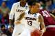 BUFFALO, NY - MARCH 20: Shabazz Napier #13 of the Connecticut Huskies controls the ball as DeAndre Bembry #43 of the Saint Joseph's Hawks defends during the second round of the 2014 NCAA Men's Basketball Tournament at the First Niagara Center on March 20,