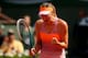 PARIS, FRANCE - JUNE 07: Maria Sharapova of Russia celebrates a point during her women's singles final match against Simona Halep of Romania on day fourteen of the French Open at Roland Garros on June 7, 2014 in Paris, France. (Photo by Clive Brunskill/