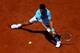 PARIS, FRANCE - JUNE 06: Novak Djokovic of Serbia returns a shot during his men's singles semi-final match against Ernests Gulbis of Latvia on day thirteen of the French Open at Roland Garros on June 6, 2014 in Paris, France. (Photo by Dan Istitene/Gett