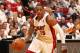MIAMI, FL - MAY 14: Mario Chalmers #15 of the Miami Heat drives against the Brooklyn Nets in Game Five of the Eastern Conference Semifinals during the 2014 NBA playoffs at American Airlines Arena in Miami, Florida on May 14, 2014. NOTE TO USER: User expr