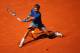 MADRID, SPAIN - MAY 09: Rafael Nadal of Spain slides to reach a backhand against Tomas Berdych of the Czech Republic in their quarter final match during day seven of the Mutua Madrid Open tennis tournament at the Caja Magica on May 9, 2014 in Madrid, Spa