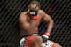 Jun 7, 2014; Albuquerque, NM, USA; Yves Edwards (red) reacts after catching a thumb to the tie against Piotr Hallmann (blue) during their lightweight bout during UFC Fight Night 42 at Tingley Coliseum. Hallmann won via third round submission. Mandatory Cr