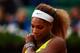 PARIS, FRANCE - MAY 28: Serena Williams of the United States reacts during her women's singles match against Garbine Muguruza of Spain on day four of the French Open at Roland Garros on May 28, 2014 in Paris, France. (Photo by Clive Brunskill/Getty Imag