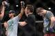 Jun 7, 2014; Albuquerque, NM, USA; Benson Henderson (red) celebrates his victory over Rustam Khabilov (blue) after their lightweight bout during UFC Fight Night 42 at Tingley Coliseum. Henderson won via fourth round submission. Mandatory Credit: Joe Campo