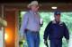 Jun 4, 2014; Elmont, NY, USA; California Chrome co owner Steve Coburn (left) and trainer Art Sherman walk from the paddock to view the morning workout in preparation for the 2014 Belmont Stakes at Belmont Park. Mandatory Credit: Anthony Gruppuso-USA TODAY