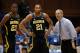 Dec 3, 2013; Durham, NC, USA; Michigan Wolverines head coach John Beilein talks to guard Zak Irvin (21) and guard Caris LeVert (23) on the sidelines against the Duke Blue Devils at Cameron Indoor Stadium. Mandatory Credit: Mark Dolejs-USA TODAY Sports