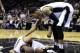 Jun 8, 2014; San Antonio, TX, USA; San Antonio Spurs guard Tony Parker (9) is checked by guard Danny Green (4) after being injured against the Miami Heat in game two of the 2014 NBA Finals at AT&T Center. Mandatory Credit: Bob Donnan-USA TODAY Sports
