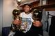 NEW YORK - JUNE 25: Tim Duncan #21 of the San Antonio Spurs holds both the Larry O'Brien trophy and MVP Trophy in his lap following Game Five of the 1999 NBA Finals at Madison Square Garden on June 25, 1999 in New York, New York. NOTE TO USER: User exp