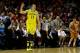 MILWAUKEE, WI - MARCH 22: Nik Stauskas #11 of the Michigan Wolverines reacts in the first half against the Texas Longhorns during the third round of the 2014 NCAA Men's Basketball Tournament at BMO Harris Bradley Center on March 22, 2014 in Milwaukee, Wi