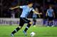 MONTEVIDEO, URUGUAY - NOVEMBER 20: Luis Suarez of Uruguay runs with the ball during leg 2 of the FIFA World Cup Qualifier match between Uruguay and Jordan at Centenario Stadium Stadium on November 20, 2013 in Montevideo, Uruguay. (Photo by Friedemann Vo
