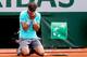 PARIS, FRANCE - JUNE 08: Rafael Nadal of Spain celebrates match point during his men's singles final match against Novak Djokovic of Serbia on day fifteen of the French Open at Roland Garros on June 8, 2014 in Paris, France. (Photo by Matthew Stockman/G