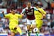 LONDON, ENGLAND - AUGUST 17: Joe Cole of West Ham United battles with Gary Medal (L) and Bo-Kyung Kim of Cardiff City during the Barclays Premier League match between West Ham United and Cardiff City at the Bolyen Ground on August 17, 2013 in London, En