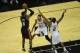 Jun 8, 2014; San Antonio, TX, USA; Miami Heat forward LeBron James (6) shoots against San Antonio Spurs forward Kawhi Leonard (2) and Tim Duncan (21) in game two of the 2014 NBA Finals at AT&T Center. Mandatory Credit: Brendan Maloney-USA TODAY Sports