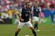 CHICAGO, IL - JULY 28: Landon Donovan #10 of the United States controls the ball against Panama during the CONCACAF Gold Cup final match at Soldier Field on July 28, 2013 in Chicago, Illinois. The United States defeated Panama 1-0. (Photo by Jonathan Da