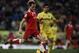 VILLARREAL, SPAIN - DECEMBER 21: Jaume Costa (R) of Villarreal competes for the ball with Ivan Rakitic of Sevilla during the La Liga match between Villarreal CF and Sevilla FC at El Madrigal on December 21, 2013 in Villarreal, Spain. (Photo by Manuel Qu