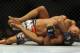 May 24, 2014; Las Vegas, NV, USA; Daniel Cormeir (red) puts Dan Henderson (blue) into a choke hold during their UFC 173 welterweight bout at MGM Grand Garden Arena. Cormeir won his bout by way of submission. Mandatory Credit: Stephen R. Sylvanie-USA TODAY