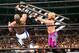 Chris Jericho nails Shelton Benjamin with a ladder.