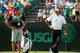 PINEHURST, NC - JUNE 09: Bubba Watson of the United States and his caddie Ted Scott wait on the green during a practice round prior to the start of the 114th U.S. Open at Pinehurst Resort & Country Club, Course No. 2 on June 9, 2014 in Pinehurst, North C
