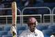Shivnarine Chanderpaul celebrates his 50, but with little support from his teammates, West Indies folded for 262.