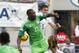 Jun 7, 2014; Jacksonville, FL, USA; Nigeria forward Shola Ameobi (23) and United States defender Matt Besler (5) miss the header during the first half at EverBank Field. Mandatory Credit: Kim Klement-USA TODAY Sports