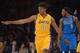 Apr 4, 2014; Los Angeles, CA, USA; Los Angeles Lakers guard Nick Young (0) reacts after a 3-point basket as Dallas Mavericks forward Jae Crowder (9) watches at Staples Center. Mandatory Credit: Kirby Lee-USA TODAY Sports