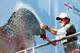 VIRGINIA WATER, ENGLAND - MAY 25: Rory McIlroy of Northern Ireland sprays champagne following his victory at the end of day four of the BMW PGA Championship at Wentworth on May 25, 2014 in Virginia Water, England. (Photo by Andrew Redington/Getty Images