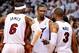 May 8, 2014; Miami, FL, USA; Miami Heat forward LeBron James (left) talks with center Chris Bosh (center) and guard Dwyane Wade (right) during the second half in game two of the second round of the 2014 NBA Playoffs against the Brooklyn Nets at American