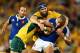 BRISBANE, AUSTRALIA - JUNE 07: Scott Fardy of the Wallabies tackles Gael Fickou of France during the First International Test Match between the Australian Wallabies and France at Suncorp Stadium on June 7, 2014 in Brisbane, Australia. (Photo by Mark Nol