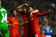 LIVERPOOL, ENGLAND - JANUARY 28: Daniel Sturridge (R) of Liverpool is congratulated by teammates Luis Suarez (C) and Raheem Sterling (L) after scoring his team's third goal as dejected Everton goalkeeper Tim Howard looks on during the Barclays Premier Le