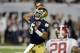 Jan 7, 2013; Miami, FL, USA; Notre Dame Fighting Irish quarterback Everett Golson (5) throws a pass against the Alabama Crimson Tide during the first half of the 2013 BCS Championship game at Sun Life Stadium. Mandatory Credit: John David Mercer-USA TODA