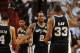 Jun 10, 2014; Miami, FL, USA; San Antonio Spurs forward Kawhi Leonard (2) high fives forward Boris Diaw (33) and guard Danny Green (4) during the first half of game three of the 2014 NBA Finals against the Miami Heat at American Airlines Arena. Mandatory