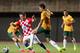 SALVADOR, BRAZIL - JUNE 06: Luka Modric of Croatia is tackled by Mark Milligan of the Socceroos during the International Friendly match between Croatia and the Australian Socceroos at Pituacu Stadium on June 6, 2014 in Salvador, Brazil. (Photo by Cameron