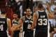 Jun 10, 2014; Miami, FL, USA; San Antonio Spurs forward Kawhi Leonard (2) high fives forward Boris Diaw (33) and guard Danny Green (4) during the first half of game three of the 2014 NBA Finals against the Miami Heat at American Airlines Arena. Mandatory