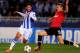 SAN SEBASTIAN, SPAIN - NOVEMBER 05: Nemanja Vidic of Manchester United tackles Carlos Vela of Real Sociedad during the UEFA Champions League Group A match between Real Sociedad de Futbol and Manchester United at Estadio Anoeta on November 5, 2013 in San