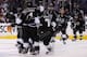 LOS ANGELES, CA - JUNE 04: Justin Williams #14 of the Los Angeles Kings and teammates celebrate Williams overtime game-winner against the New York Rangers as the Kings defeated the Rangers 3-2 during Game One of the 2014 NHL Stanley Cup Final at the Stap