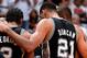 MIAMI, FL - JUNE 10: Kawhi Leonard #2 and Tim Duncan #21 of the San Antonio Spurs huddle during Game Three of the 2014 NBA Finals between the Miami Heat and San Antonio Spurs at the American Airlines Arena on June 10, 2014 in Miami, Florida. NOTE TO USER: