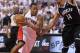 TORONTO, ON - MAY4: Kyle Lowry #7 of the Toronto Raptors drives around Shaun Livingston #14 of the Brooklyn Nets in Game Seven of the NBA Eastern Conference Quarterfinals at the Air Canada Centre on May 4, 2014 in Toronto, Ontario, Canada. The Nets defea