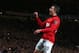 MANCHESTER, ENGLAND - MAY 06: Robin van Persie of Manchester United celebrates scoring his team's third goal during the Barclays Premier League match between Manchester United and Hull City at Old Trafford on May 6, 2014 in Manchester, England. (Photo b