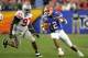 GLENDALE, AZ - JANUARY 08: Quarterback Chris Leak #12 of the Florida Gators scrambles with the ball under pressure from David Patterson #97 of the Ohio State Buckeyes during the 2007 Tostitos BCS National Championship Game at the University of Phoenix St